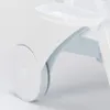 A close-up view of the wheel and a tray on a white reclining chair. Voir les images du produit