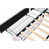 Close-up view of the underside of a bed frame, showing the metal support structure and wooden slats. Podgląd zdjęcia produktu