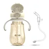 A baby bottle with a straw attachment and a separate straw assembly, presented against a white background. Produktbild-Vorschau