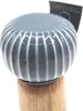 A close-up shot of the top of a mill with a ceramic top and a wooden base. Podgląd zdjęcia produktu