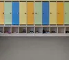 A row of colorful lockers with shoe cubbies below. Podgląd zdjęcia produktu