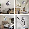 Collage of four images showing a moon-shaped wall light in different room settings: living room, hallway, bedroom, and staircase. Náhled obrázku produktu