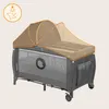 A baby crib/playpen with a mosquito net canopy. Produktbild-Vorschau