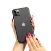 A person's hands are holding a black smartphone. Produktbild-Vorschau