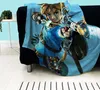 A blanket with a character from The Legend of Zelda is draped over a black sofa. Anteprima dell’immagine prodotto