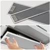 A collage showing two views of a range hood filter. The top image shows two filters stacked on a white background. The bottom image shows a hand inserting a filter into a range hood. Náhľad obrázku produktu