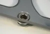 Close-up view of a metal component with a screw and washers. Produktbild-Vorschau
