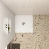 A top-down view of a modern bathroom shower area with a white shower tray and a speckled floor. Produktbild-Vorschau