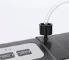 A close-up view of a vacuum sealer machine with a tube attached. Podgląd zdjęcia produktu