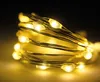 A close-up shot of a coiled string of warm white LED lights. Produktbild-Vorschau