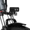 A close-up view of the front of an electric bicycle, focusing on the headlight and front fender. Produktbild-Vorschau