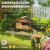 A rabbit hutch with an attached run in a grassy outdoor setting. Produktbild-Vorschau