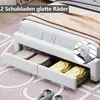 A white bed frame with storage drawers, showing folded towels and yellow clothing inside. A close-up of a wheel is also shown. Voir les images du produit