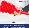 A person is holding a red plunger over a white sink. Náhľad obrázku produktu