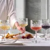 A person is serving drinks and appetizers on a table. Náhled obrázku produktu