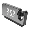 A black digital alarm clock with a mirrored display showing the time and a projection lens on the side. Anteprima dell’immagine prodotto