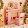 A pink children's vanity desk with a chair, decorated for Christmas with a tree and Santa figure. Náhled obrázku produktu