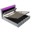A modern upholstered bed frame with a built-in headboard featuring LED lighting and storage compartments. Náhled obrázku produktu