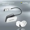 A VARTA LED book light with two CR2032 batteries shown against a gradient background. Anteprima dell’immagine prodotto