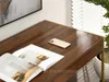 Close-up of a wooden desk with a magazine and a smartphone on it. Voir les images du produit