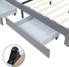 Close-up view of a bed frame with drawers, showing a detail of a drawer wheel. Produktbild-Vorschau