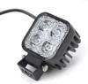 A close-up studio shot of a square LED work light with a black housing and a metal bracket. Produktbild-Vorschau