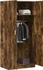 An open wardrobe with clothes hanging inside and folded clothes on a shelf. Voir les images du produit