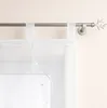 A close-up view of a white sheer curtain hanging from a silver curtain rod. Produktbild-Vorschau