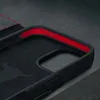 Close-up view of the interior of a black leather iPhone case with red detailing. Produktbild-Vorschau