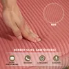 A hand is pressing into a textured pink fabric, likely a cushion or upholstery, with text overlays highlighting product features. Náhled obrázku produktu