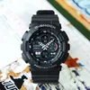 A black Casio G-Shock watch is displayed on a surface with some colorful elements in the background. Produktbild-Vorschau