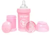 A pink baby bottle and its accessories are arranged on a white background. Podgląd zdjęcia produktu