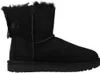 A black Ugg boot with a bow on the side, shown from the side against a white background. Produktbild-Vorschau