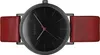 A top-down view of a Bering watch with a black face and a red leather strap. Produktbild-Vorschau