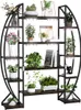 A multi-tiered plant stand with integrated grow lights, filled with various potted plants and decorative items. Produktbild-Vorschau