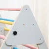Close-up of a wooden climbing triangle with colorful bars. Voir les images du produit