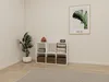 A white cube shelf unit with brown storage boxes and books is placed in a room with a plant and a framed picture on the wall. Produktbild-Vorschau