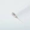A roll of white matte self-adhesive film is shown on a white background. Podgląd zdjęcia produktu