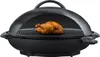 A black electric grill with a whole roasted chicken on the cooking grate. Podgląd zdjęcia produktu