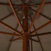 Close-up view of the internal structure of a parasol, showing the wooden mast and spokes. Náhľad obrázku produktu