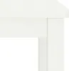 A close-up view of the corner of a white wooden table or cabinet. Produktbild-Vorschau