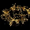 A string of warm white LED cluster lights on a black background. Produktbild-Vorschau