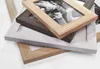 A stack of wooden picture frames in different colors and sizes. Náhled obrázku produktu