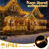 A house decorated with warm white icicle lights for Christmas. Anteprima dell’immagine prodotto