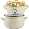 Two cream-colored pots with speckled details, one filled with orange soup and garnished with cream and parsley, the other covered with a glass lid. Produktbild-Vorschau