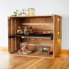 A wooden crate shelf unit decorated with jars, flowers, and fairy lights. Podgląd zdjęcia produktu