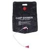 A black camping shower bag with a hose and shower head attached, shown against a white background. Produktbild-Vorschau