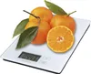 A digital kitchen scale with tangerines on it. Produktbild-Vorschau