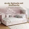 A pink upholstered bed with pillows and blankets, set in a child's bedroom with decorative elements. Anteprima dell’immagine prodotto