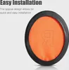 Close-up of an orange ear cushion with a black rim, with text overlay. Voir les images du produit